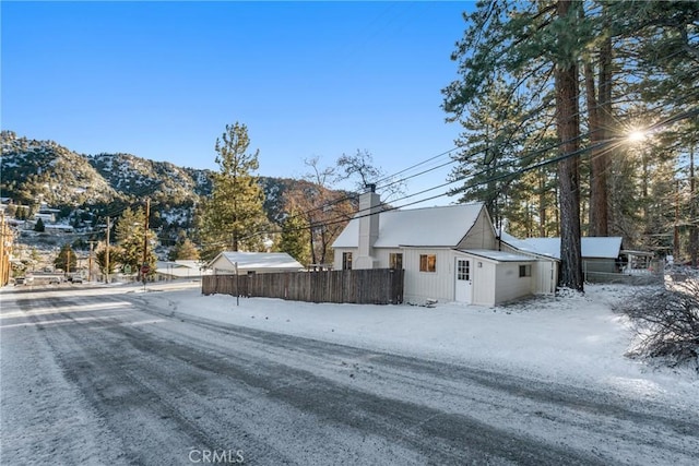 1131 Apple Ave, Wrightwood, CA 92397 - exterior space featuring a chimney, a mountain view, and fence