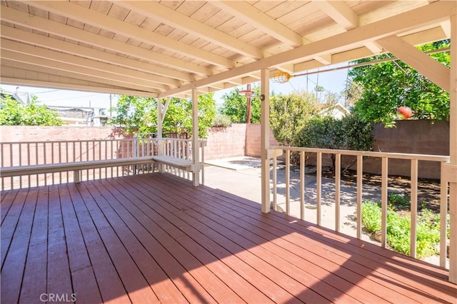 deck with a patio area and a fenced backyard