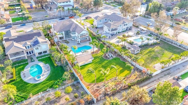 birds eye view of property with a residential view