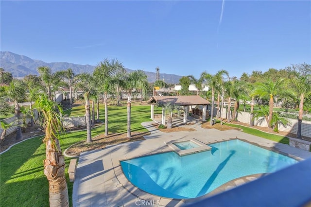 view of pool featuring a gazebo, a yard, a patio area, and a mountain view