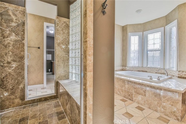 bathroom with tiled shower, tile patterned flooring, and a garden tub