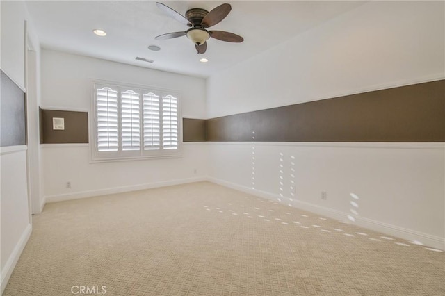 unfurnished room with recessed lighting, carpet floors, visible vents, baseboards, and a ceiling fan