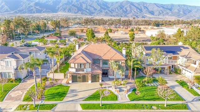 birds eye view of property with a residential view and a mountain view