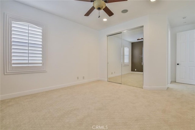 unfurnished bedroom with carpet, recessed lighting, a closet, ceiling fan, and baseboards