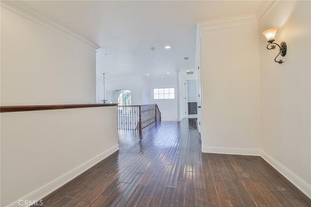 hallway with ornamental molding, dark wood-style flooring, recessed lighting, and baseboards