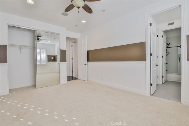 unfurnished bedroom featuring carpet, visible vents, a closet, and recessed lighting