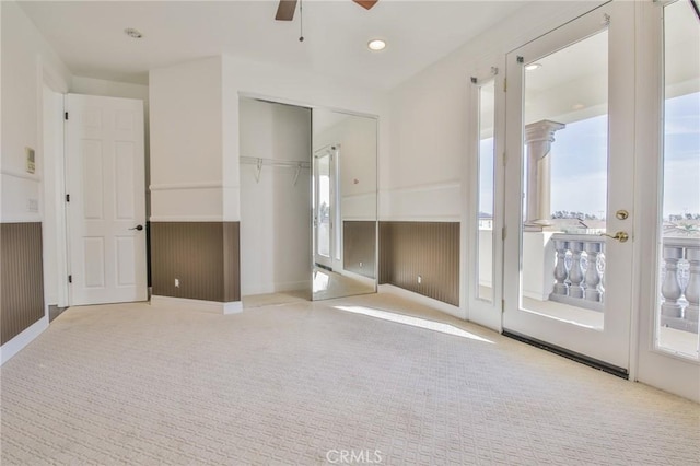 spare room featuring ceiling fan, wainscoting, carpet flooring, and recessed lighting