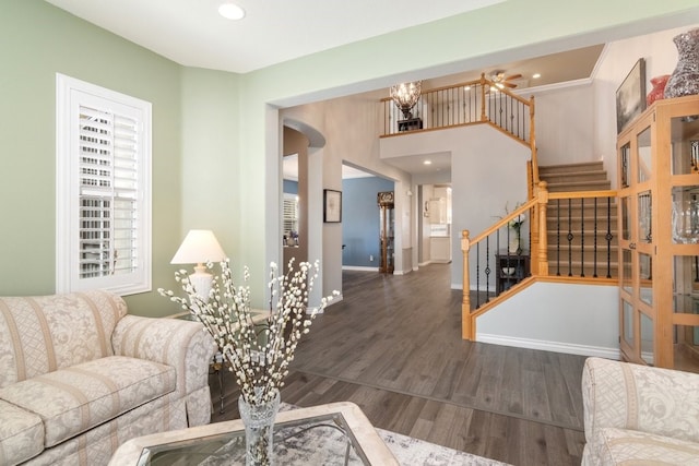 living room with recessed lighting, stairway, a ceiling fan, wood finished floors, and baseboards