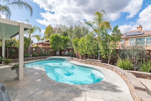 view of swimming pool with a fenced backyard, a fenced in pool, and a patio