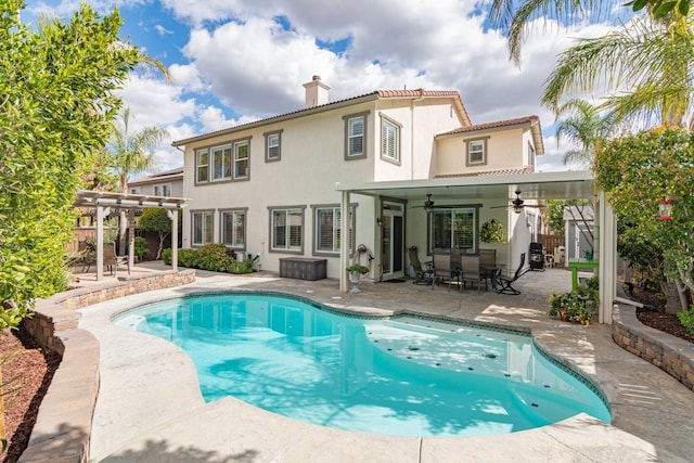 view of swimming pool with a fenced in pool, a patio area, ceiling fan, and a pergola