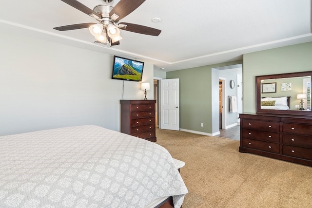 carpeted bedroom featuring baseboards and a ceiling fan