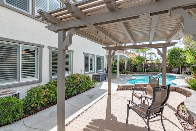 view of patio / terrace featuring a fenced in pool, a fenced backyard, a deck, and a pergola