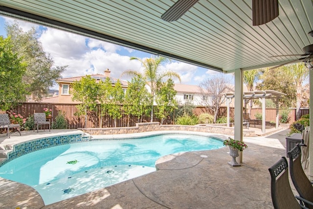 view of swimming pool featuring a fenced in pool, a patio area, a fenced backyard, and a pergola