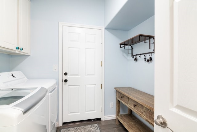 laundry area with dark wood-style floors, cabinet space, and separate washer and dryer