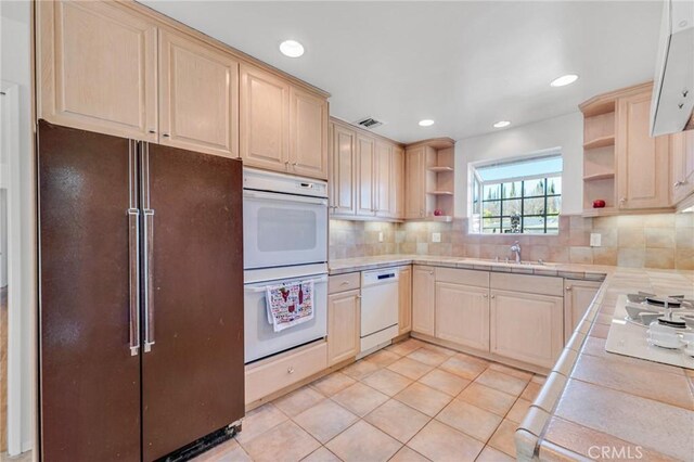 kitchen featuring open shelves, white appliances, light brown cabinets, and tasteful backsplash