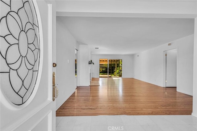 foyer entrance with wood finished floors