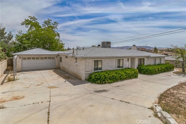 11671 Jacaranda Ave, Hesperia, CA 92345 - single story home with fence, driveway, a chimney, and a garage