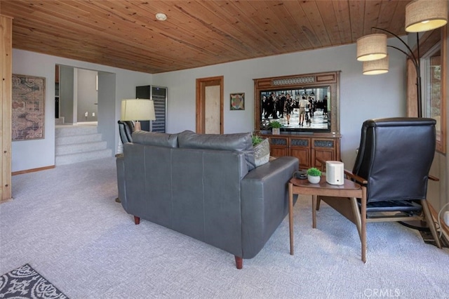 living area featuring carpet floors, wood ceiling, and baseboards