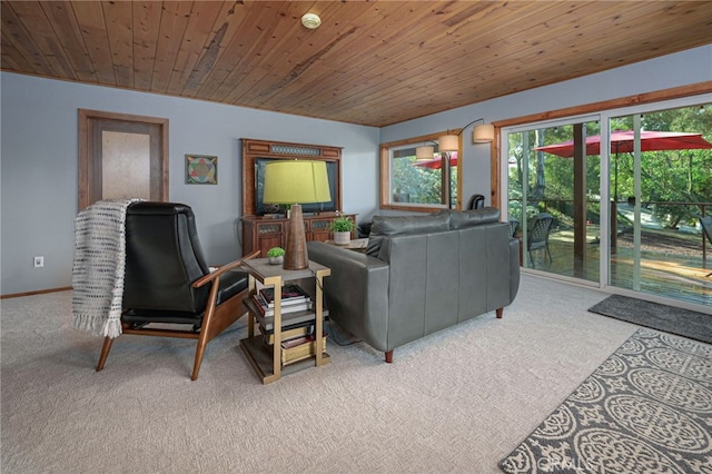 carpeted living room featuring wood ceiling