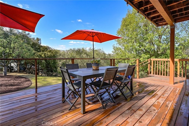 wooden deck with outdoor dining area