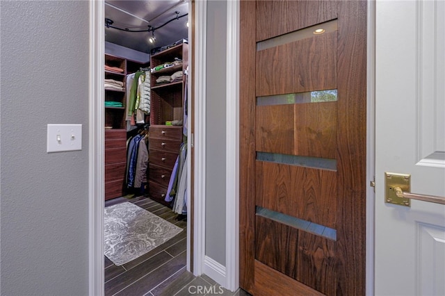 spacious closet featuring wood finish floors