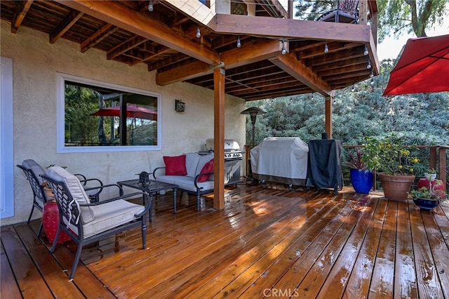 wooden deck with a grill