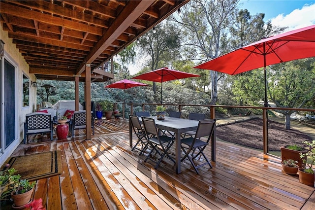 deck with outdoor dining space