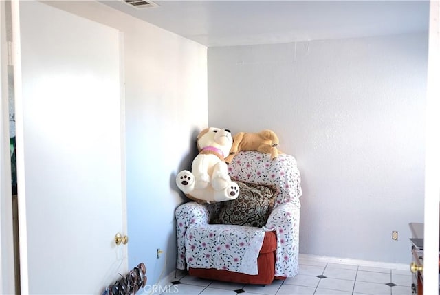 living area featuring light tile patterned floors