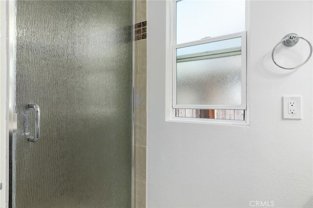 full bath with a shower stall