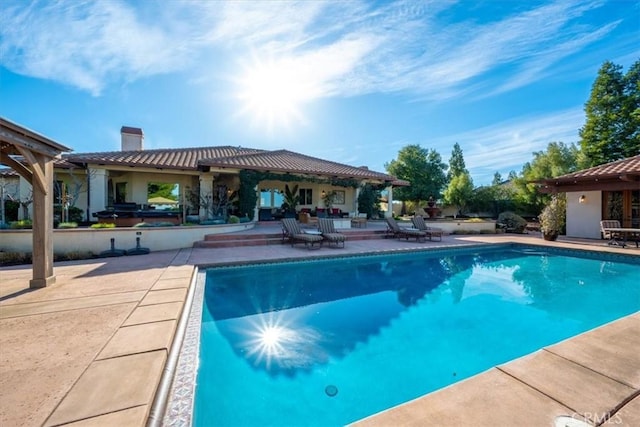 pool with a patio