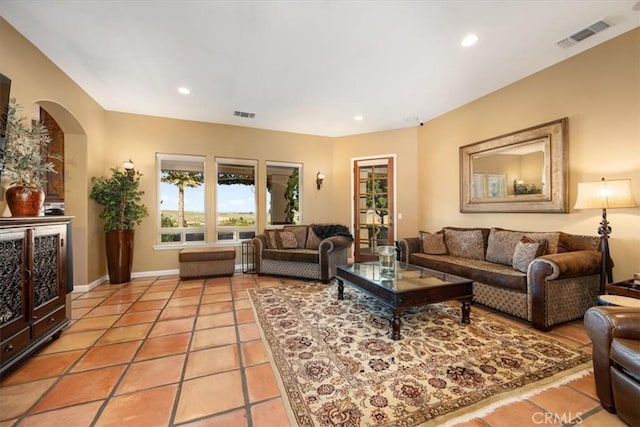 living room featuring recessed lighting, visible vents, and light tile patterned floors