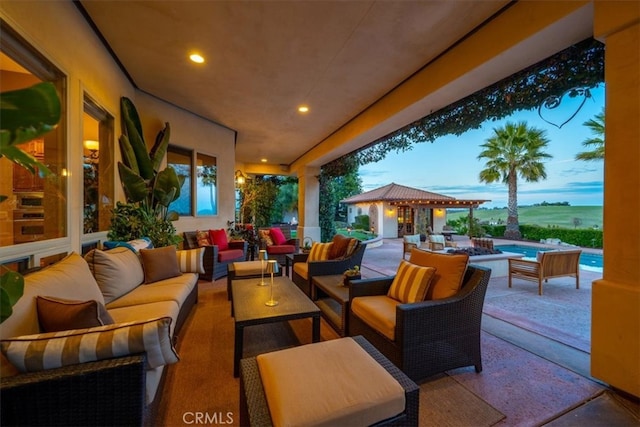 view of patio / terrace featuring an outdoor hangout area and an outdoor pool