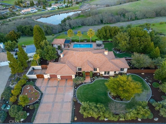 birds eye view of property with a water view