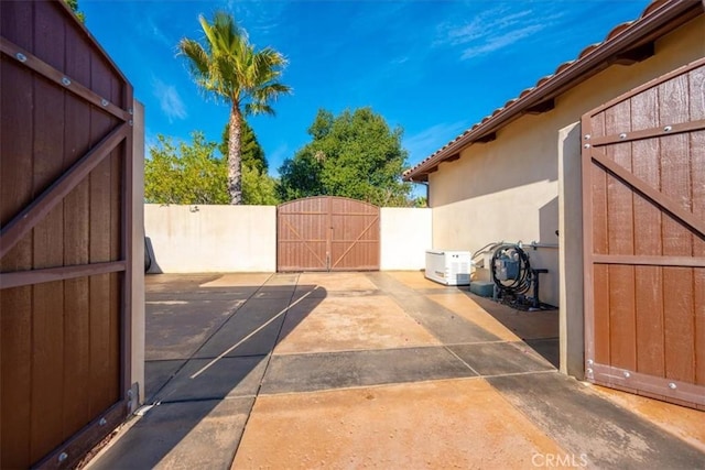 view of patio / terrace with a gate and fence