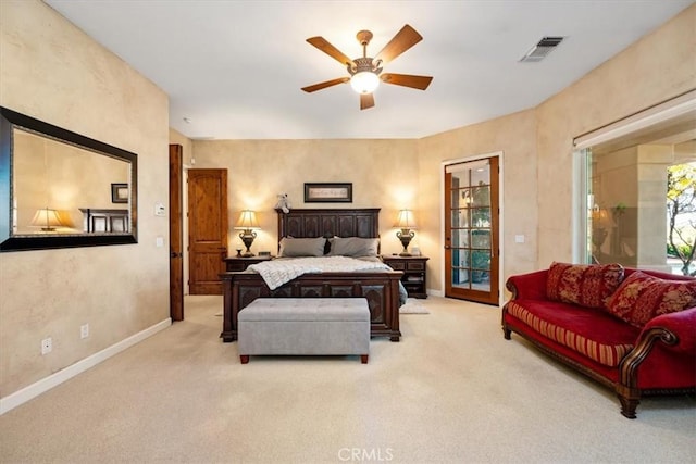 bedroom featuring carpet floors, visible vents, baseboards, and a ceiling fan