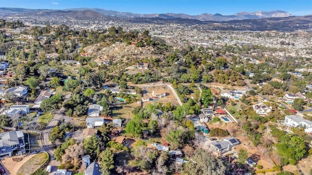 birds eye view of property with a mountain view