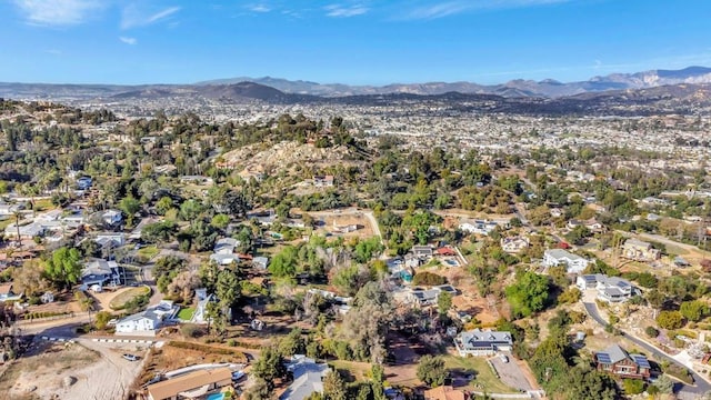 birds eye view of property with a mountain view