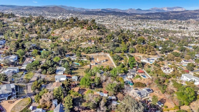 birds eye view of property featuring a mountain view