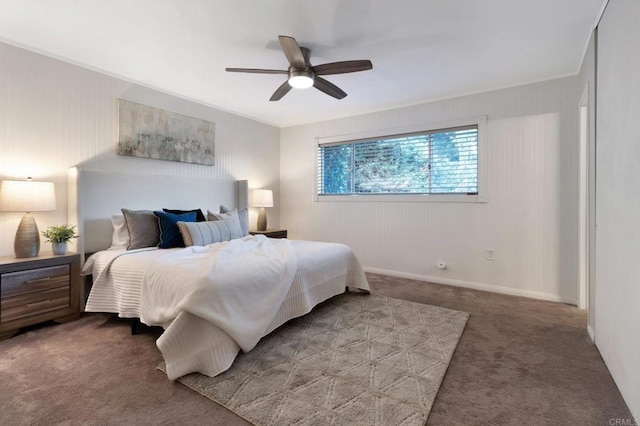 bedroom featuring carpet floors, crown molding, baseboards, and ceiling fan