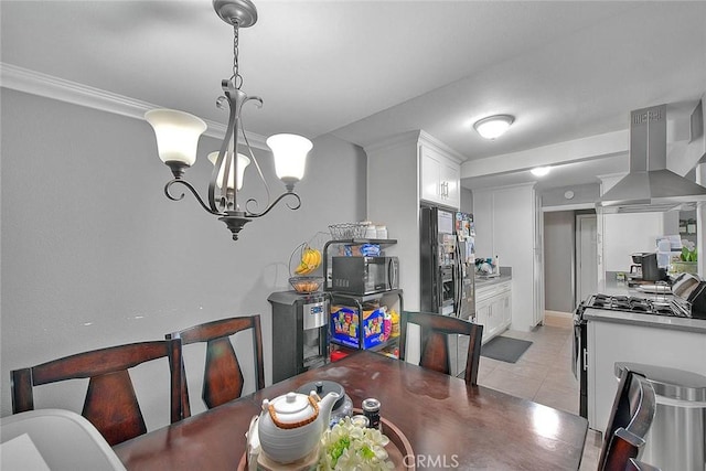 dining area featuring an inviting chandelier and light tile patterned flooring