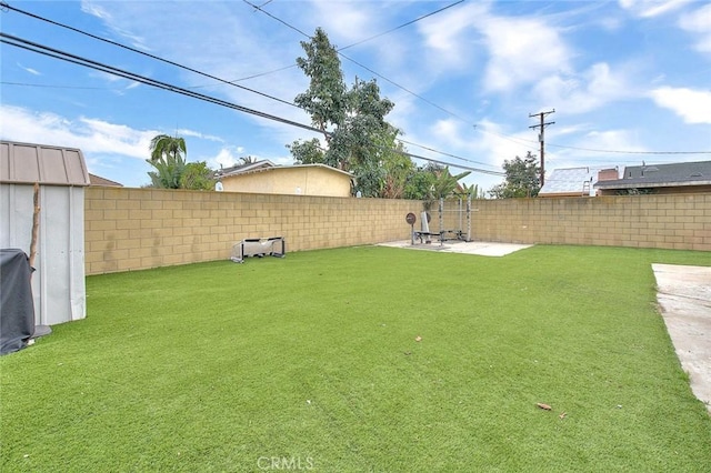 view of yard with a patio and a fenced backyard