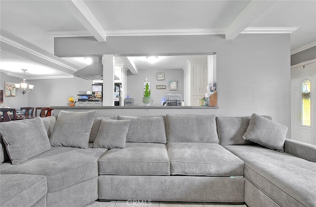 living area featuring a chandelier, ornamental molding, and beamed ceiling