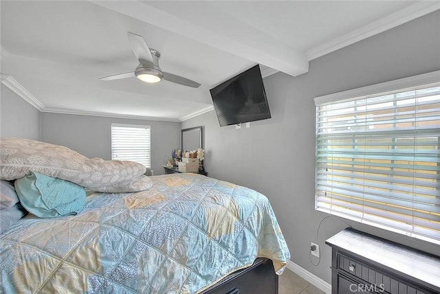 bedroom with baseboards, ceiling fan, ornamental molding, tile patterned flooring, and beam ceiling