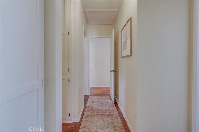 hallway featuring baseboards