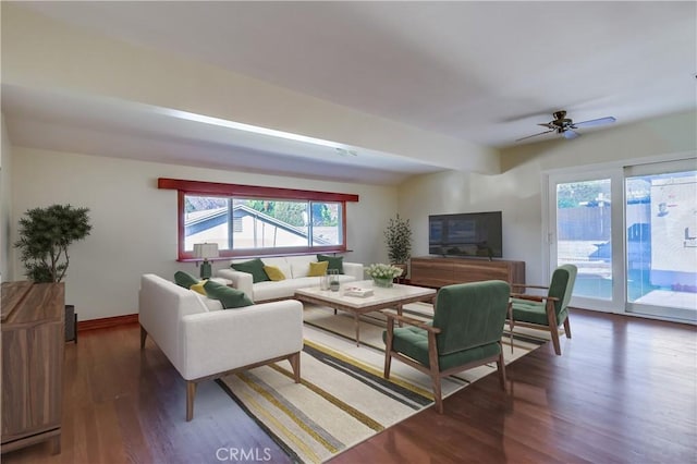 living area featuring wood finished floors and baseboards