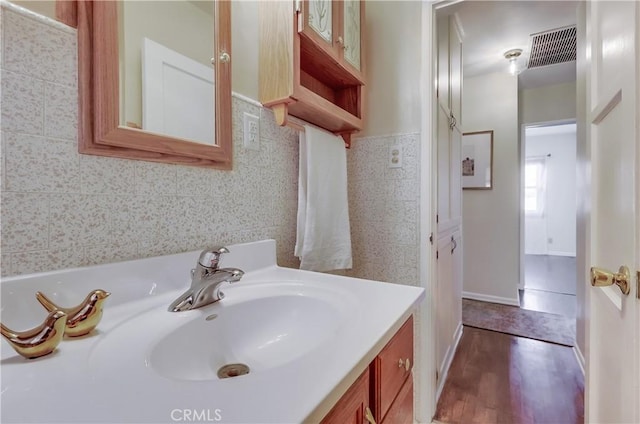 bathroom featuring vanity and visible vents