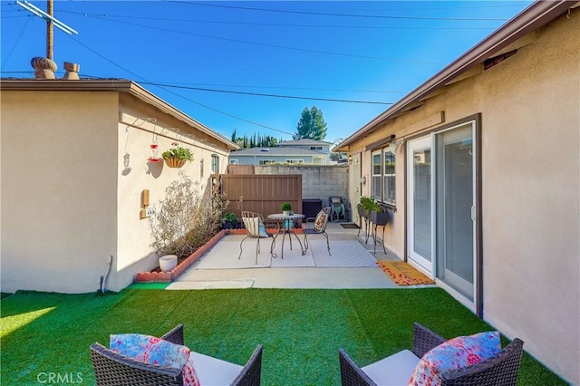 view of patio / terrace with fence