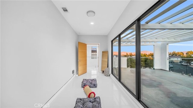 doorway featuring visible vents and a healthy amount of sunlight