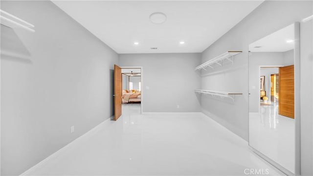 spacious closet featuring visible vents