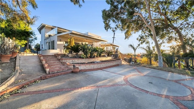 exterior space with fence and stucco siding